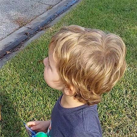 child finds butterfly chrysalis