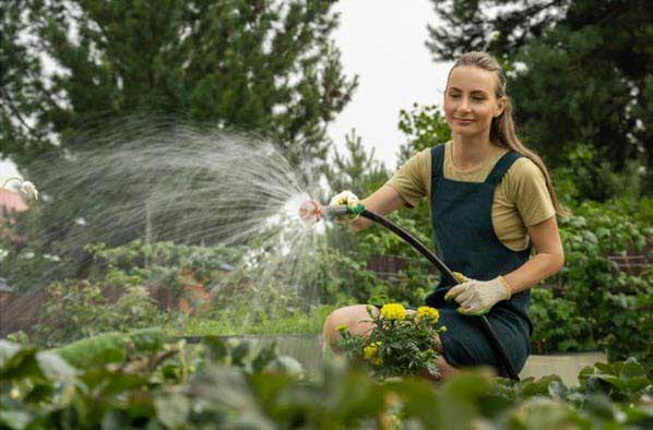 watering flowers | Gardens with Wings